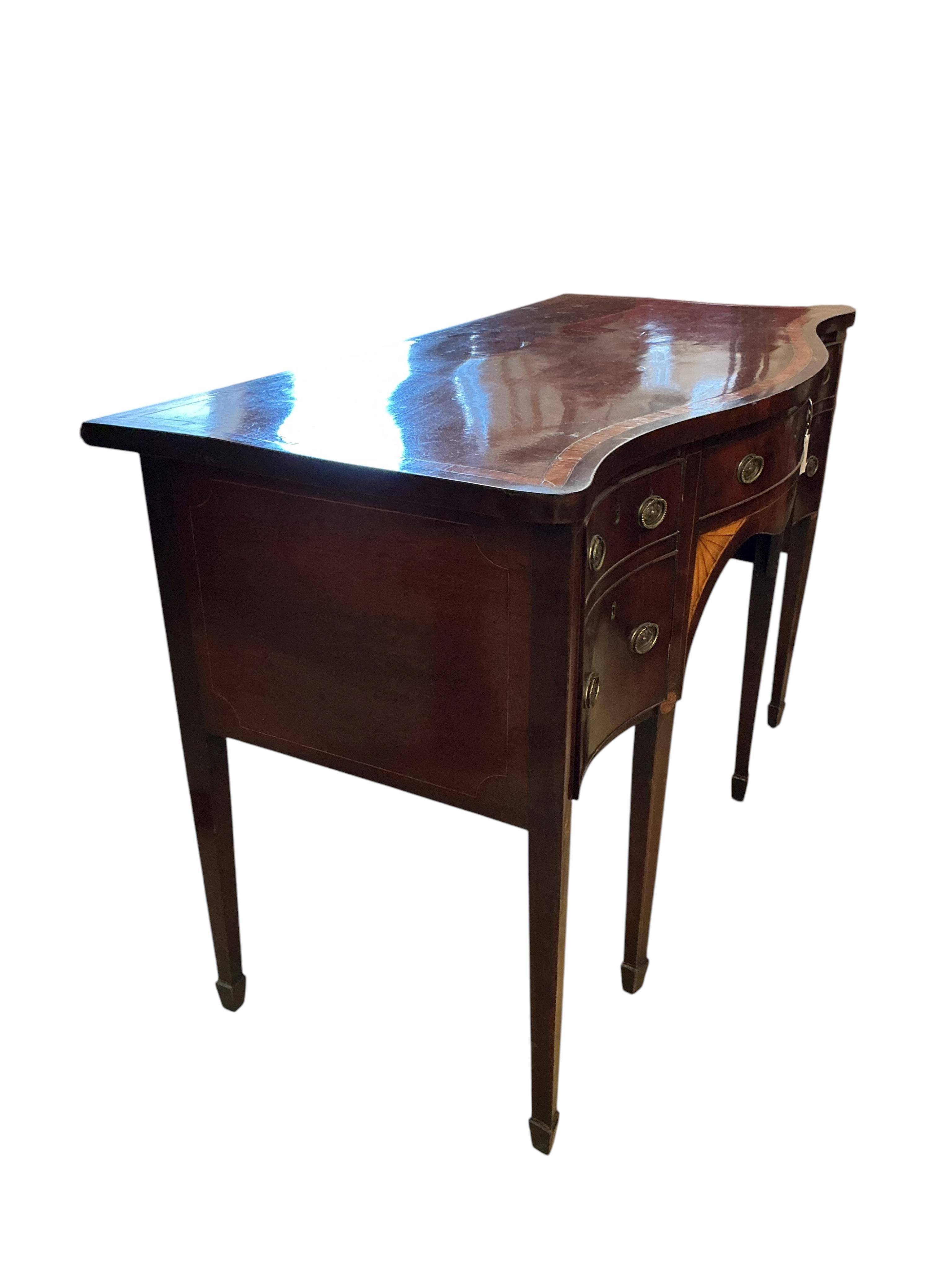 A George III satinwood banded mahogany serpentine sideboard, width 138cm, depth 69cm, height 92cm